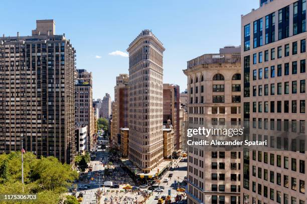 aerial view of new york skyline on a sunny day with flatiron building, new york, usa - broadway manhattan fotografías e imágenes de stock