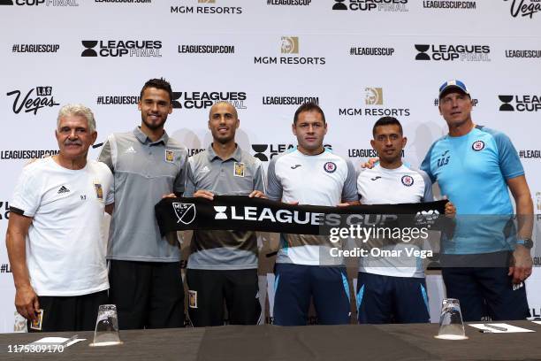 Head coach Ricardo Ferretti, Diego Reyes and Guido Pizarro of Club Tigres pose with Pablo Aguilar, Elias Hernandez, and Head coach of Cruz Azul...