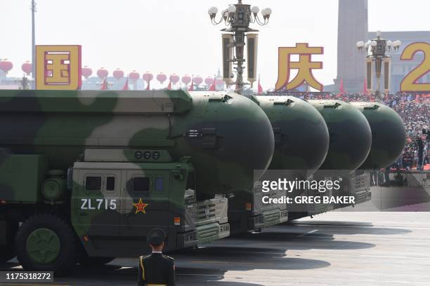 China's DF-41 nuclear-capable intercontinental ballistic missiles are seen during a military parade at Tiananmen Square in Beijing on October 1 to...