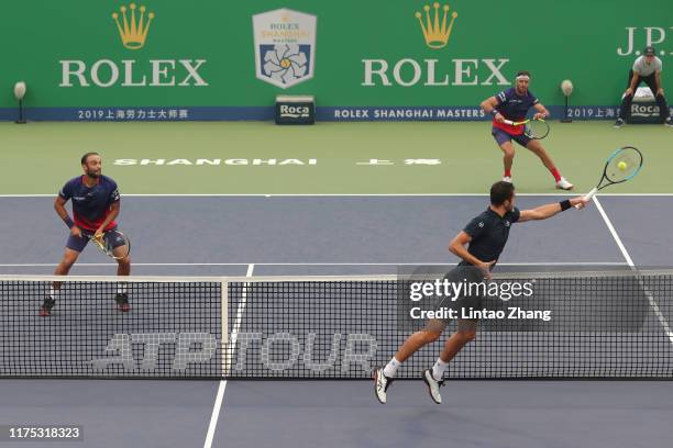 Mate Pavic of Croatia and Bruno Soares of Brazil in action against Juan Sebastian Cabal of Columbia and Robert Farah of Columbia during their Men's...