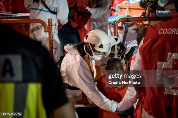 Young rescued boy disembarks at the Malaga's harbour, in Malaga, southern of Spain, on October 9, 2019.