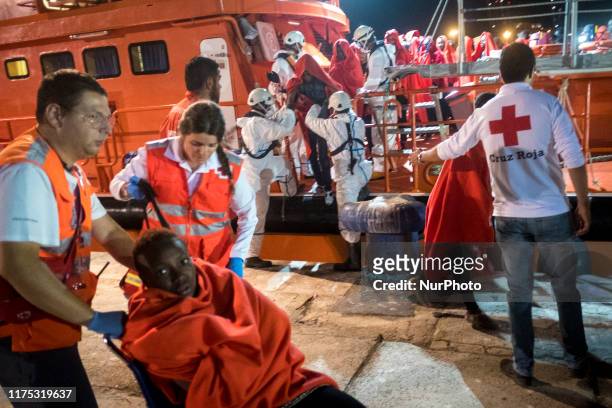 Rescued migrants from the Mediterranean sea disembark at the Malaga's harbour, in Malaga, southern of Spain, on October 9, 2019.