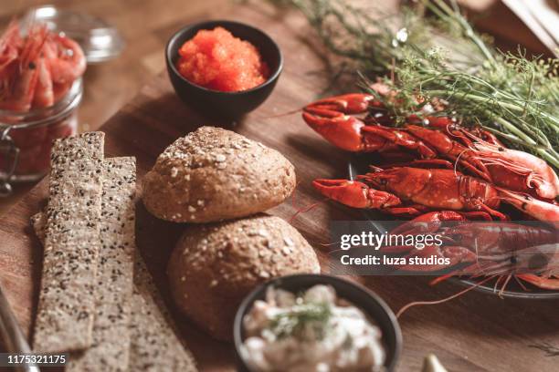 traditional swedish ready to eat crayfish dinner - crayfish stock pictures, royalty-free photos & images