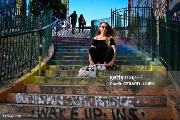 French feminist, graphic and founder of the blog "Paye Ta Shnek" Tumblr group, where the women can testify their harassment, Anais Bourdet, poses in...
