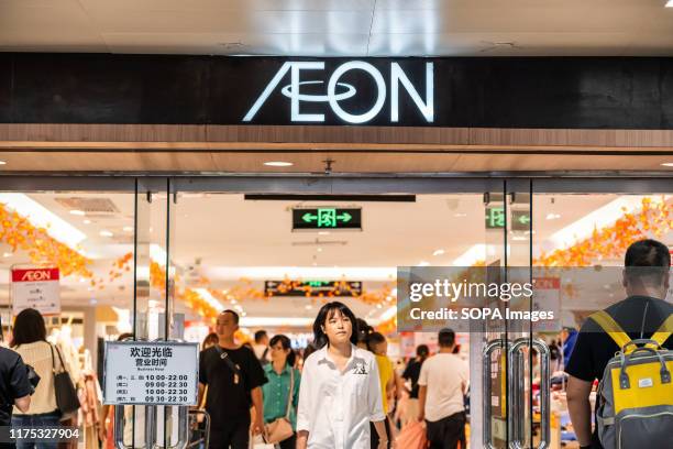 Customers visit an AEON shopping mall in Guangzhou.