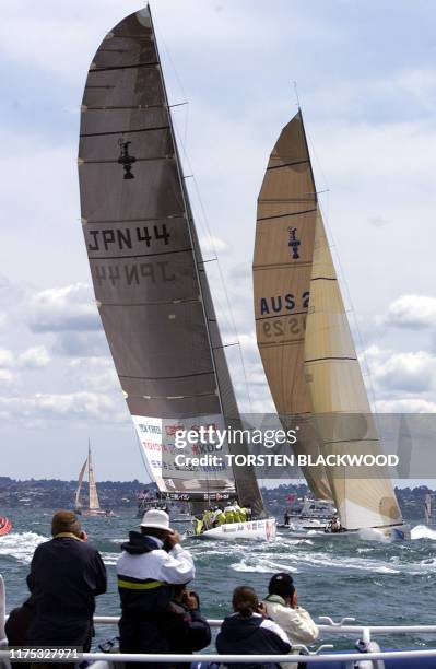 Spectators watch "Young Australia 2000" , skippered by 20-year-old James Spithill, and Japan's Nippon Challenger "Asura" , skippered by Peter...