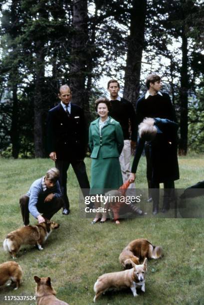 Picture of Queen Elizabeth and Duke of Edinburgh posing with theirs three sons, Charles , Edward , Andrew , her daughter princess Anne and the royal...