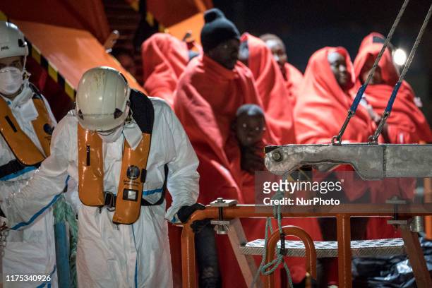 Group of rescued migrants waits onboard the Spanish Maritime vessel, in Malaga, southern of Spain, on October 9, 2019.