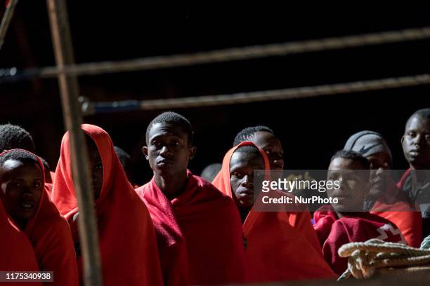 Group of rescued migrants waits onboard the Spanish Maritime vessel, in Malaga, southern of Spain, on October 9, 2019.