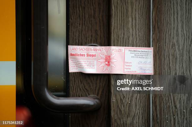 Police seal is seen on October 10, 2019 on the door of the doner kebab restaurant in Halle an der Saale, eastern Germany, that was one of the sites...