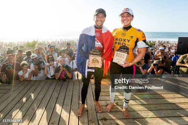 Jeremy Flores of France and Carissa Moore of Hawaii are the winners the 2019 Quiksilver & Roxy Pro France at Le Graviere on October 11, 2019 in...