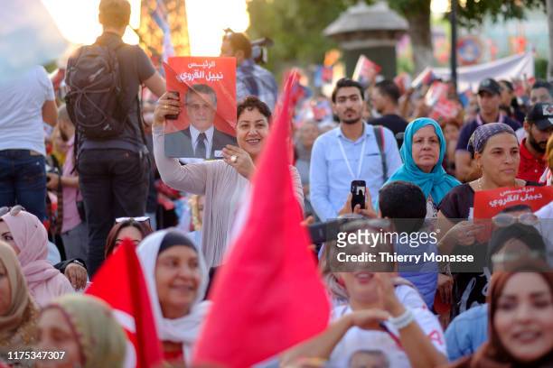 Supporters of the Tunisian presidential candidate, Media mogul Nabil Karoui are waiting for there leaders during a presidential campaign rally on...