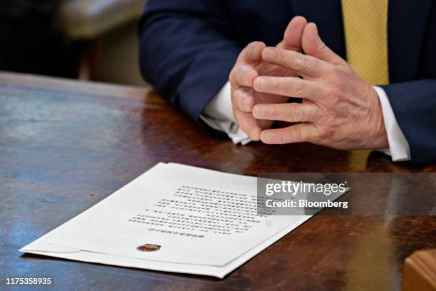 Letter to U.S. President Donald Trump from Chinese Vice Premier Liu He sits on the Resolute Desk in front of Trump during a meeting with Liu He, not...