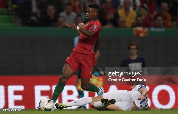 Nelson Semedo of Portugal and FC Barcelona with Dirk Carlson of Luxembourg in action during the UEFA Euro 2020 Qualifier match between Portugal and...