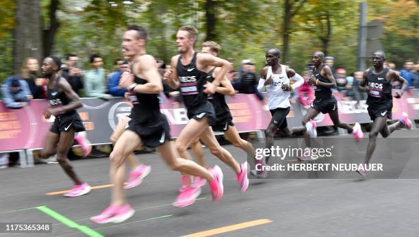 Kenya's Eliud Kipchoge runs during his attempt to bust the mythical two-hour barrier for the marathon on October 12 2019 in Vienna. - Kipchoge holds...