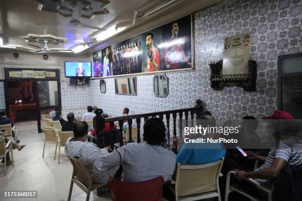 Tunisians watching the televised presidential debate held between presidential candidates, Kais Saied and Nabil Karoui, ahead of the second round of...