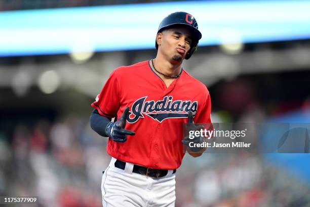 Oscar Mercado of the Cleveland Indians celebrates as he rounds the bases after hitting a solo homer during the first inning against the Detroit...