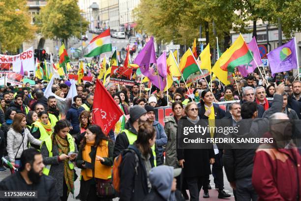 Kurdish protesters take part in a demonstration holding kurdish flags in Stockholm, Sweden, on October 12 to support Kurdish militants as Turkey kept...