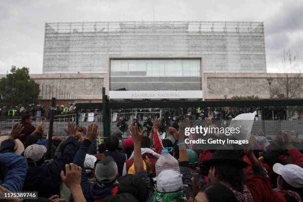 Hundreds of people gather in front of the National Assembly to try to dialogue with the police during the protests against the economic measures...