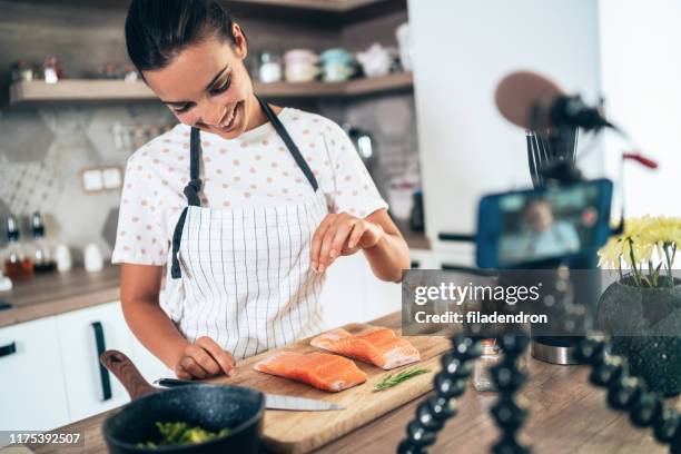 cooking and vlogging - cooking fish stock pictures, royalty-free photos & images