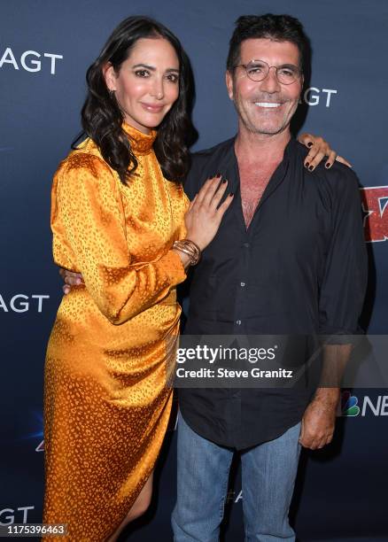 Lauren Silverman and Simon Cowell arrives at the "America's Got Talent" Season 14 Live Show Red Carpet at Dolby Theatre on September 17, 2019 in...