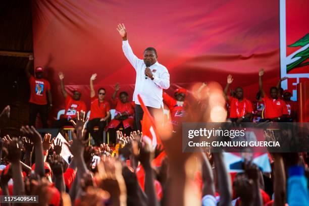 Mozambican ruling Party FRELIMO Presidential Candidate and Incumbent Mozambican President Filipe Nyusi gestures as he delivers a speech during his...