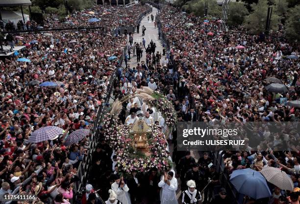 Catholic faithful gather to receive the image of the Virgin of Zapopan, during the annual pilgrimage to the Basilica of Zapopan, in Zapopan, state of...