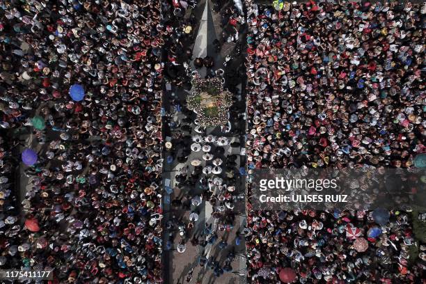 Catholic faithful gather to receive the image of the Virgin of Zapopan, during the annual pilgrimage to the Basilica of Zapopan, in Zapopan, state of...