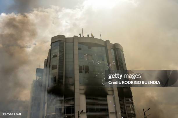 View of the Comptroller General's Office building after demonstrators broke in, during the 10th day of a protest over a fuel price hike ordered by...