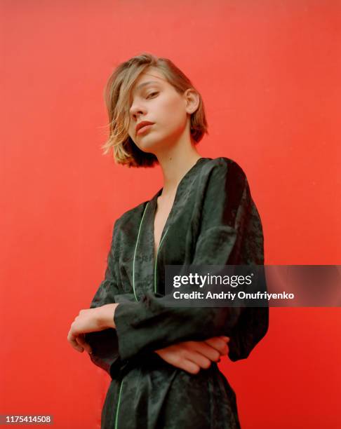 portrait of young beautiful woman - red dress stock-fotos und bilder