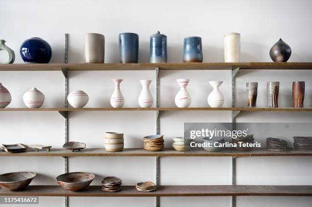 handmade ceramic vases and dishes on display in a shop - craft show stock pictures, royalty-free photos & images