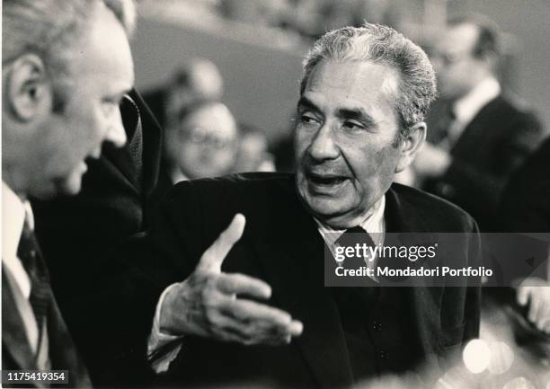 Italian politician Aldo Moro chatting during a public meeting. 1970s