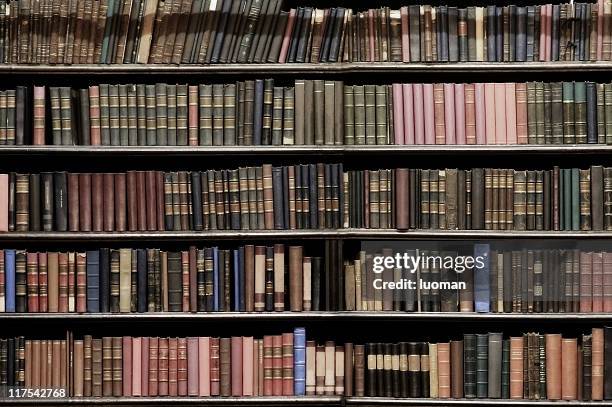 very old books - bookshelf stockfoto's en -beelden