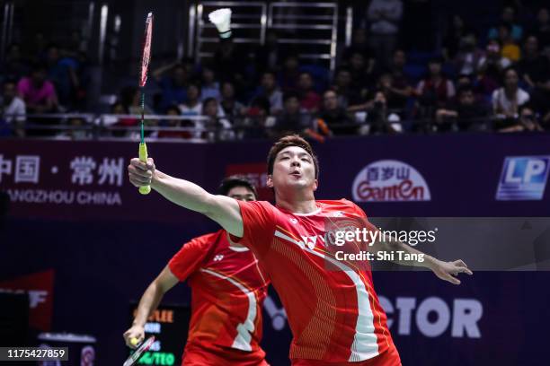 Lee Yong Dae and Kim Gi Jung of Korea compete in the Men's Doubles first round match against Ong Yew Sin and Teo Ee Yi of Malaysia on day two of the...