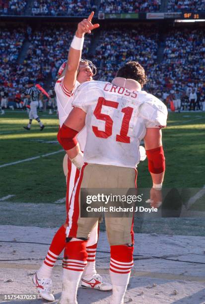 Joe Montana, C Randy Cross on the sidelines. San Francisco 49ers 48 vs San Diego Chargers 10 at Jack Murphy Stadium in San Diego, California.