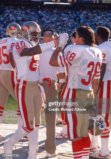 Jerry Rice and SS Greg Cox share a high five on the sidelines during a blowout of the Chargers. San Francisco 49ers 48 vs San Diego Chargers 10 at...