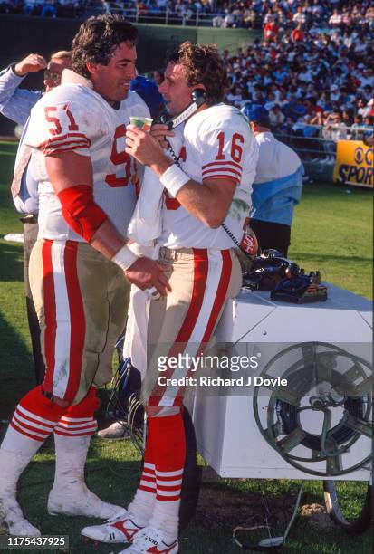 Joe Montana and C Randy Cross on the sidelines. San Francisco 49ers 48 vs San Diego Chargers 10 at Jack Murphy Stadium in San Diego, California.