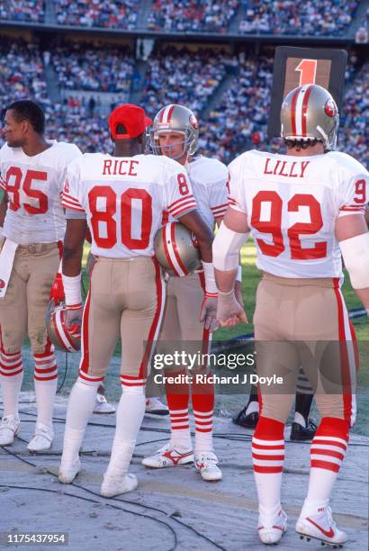 Joe Montana, WR Jerry Rice, DE Kevin Lilly, and WR Mike Wilson on the sidelines. San Francisco 49ers 48 vs San Diego Chargers 10 at Jack Murphy...