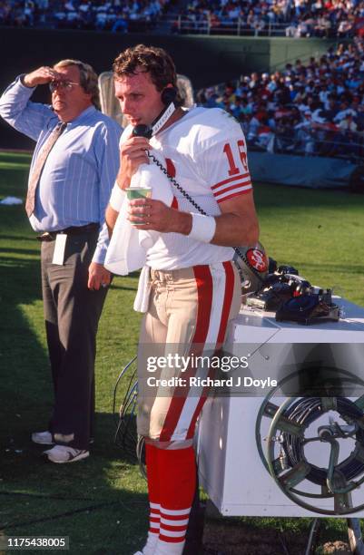 Joe Montana on the phone on the sidelines. San Francisco 49ers 48 vs San Diego Chargers 10 at Jack Murphy Stadium in San Diego, California.