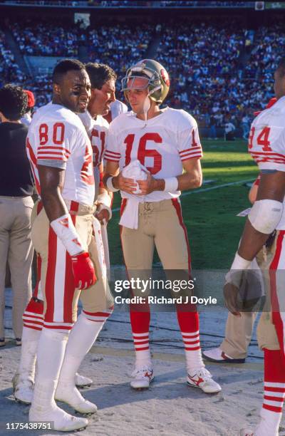 Joe Montana, WR Jerry Rice, C Randy Cross conversing on the sidelines. San Francisco 49ers 48 vs San Diego Chargers 10 at Jack Murphy Stadium in San...