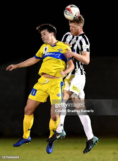 Shaun Timmins of the Zebras gets above Jacob McLean of the Strikers during the FFA Cup 2019 Quarter Finals match between the Brisbane Strikers and...