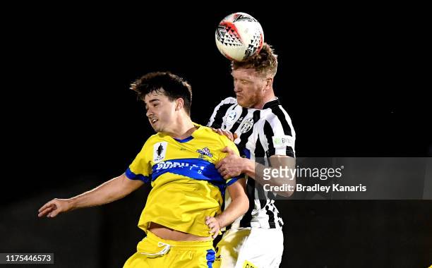 Shaun Timmins of the Zebras gets above Jacob McLean of the Strikers during the FFA Cup 2019 Quarter Finals match between the Brisbane Strikers and...