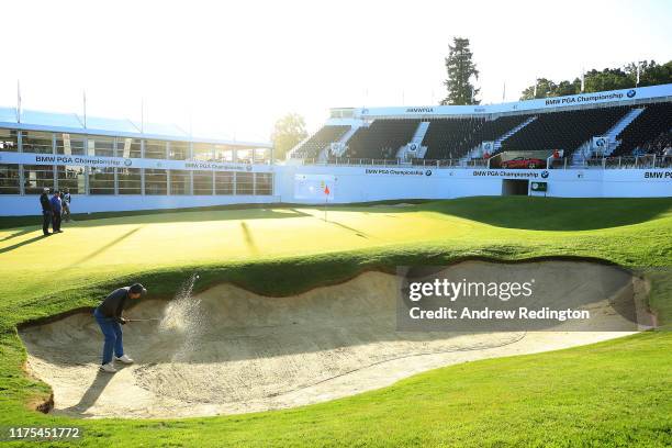 David Williams, Chairman European Tour plays a shot out of the bunker during the Pro-Am tournament prior to the start of the BMW PGA Championship at...