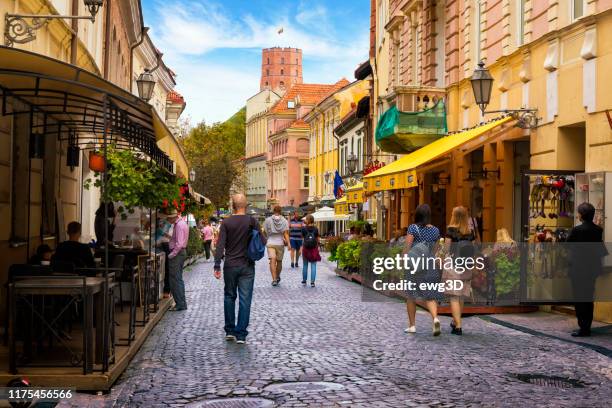 pilies street in vilnius old town - lithuania people stock pictures, royalty-free photos & images