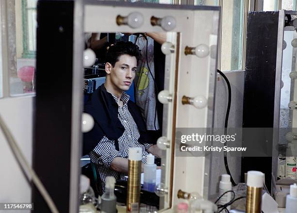 Model prepares backstage before the Bill Tornade Menswear Spring/Summer 2012 show as part of Paris Fashion Week at Lycee Turgot on June 26, 2011 in...