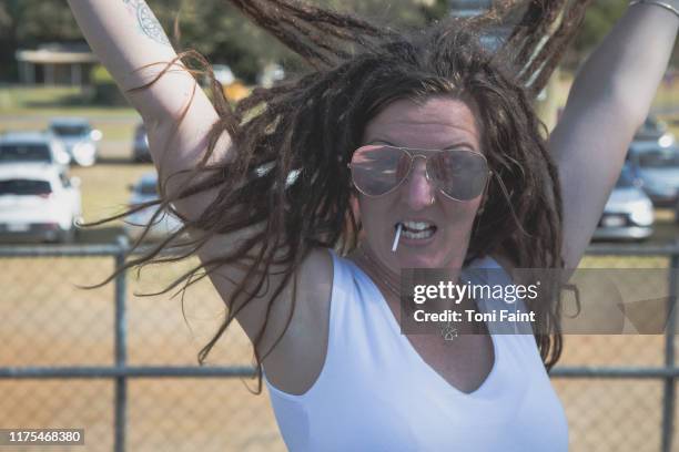 a portrait of a beautiful 30 year old female with dreadlocks - self suck foto e immagini stock