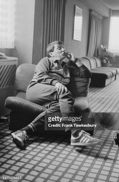 English football player, manager, pundit and chairman of Watford Football Club Graham Taylor sitting in an armchair, UK, 21st May 1984.