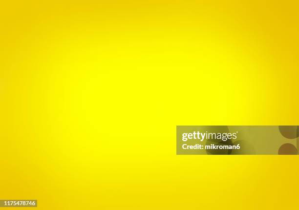 yellow shaded paper background - yellow hat stock-fotos und bilder
