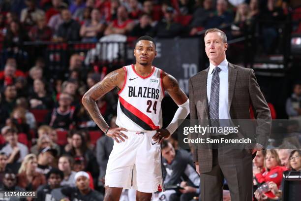 Head Coach Terry Stotts, and Kent Bazemore of the Portland Trail Blazers are seen talking during a pre-season game against the Phoenix Suns on...