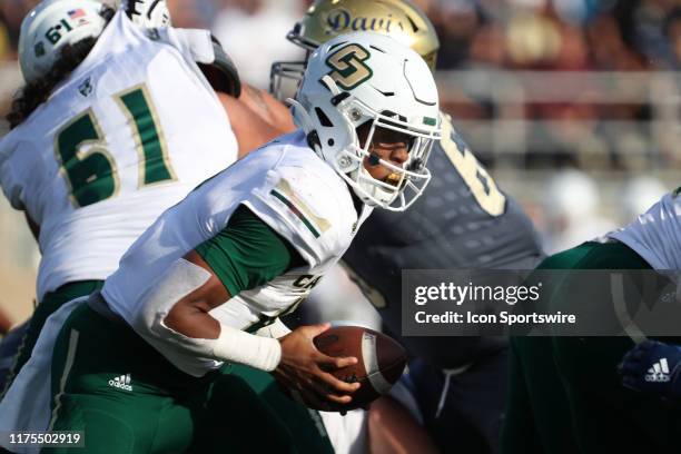 Cal Poly Quarterback Jalen Hamler takes the snap during the game between the UC Davis Aggies and the Cal Poly Mustangs on October 12 at Aggie Stadium...